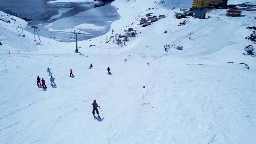 Portillo Ski Station Centre In Andes Mountains Valparaiso Chile. Skier Skiing Downhill On Empty Ski Slopes In The Mountains. Nature Travel Snow Covered Forest Trees. Nature Outside Aerial View.