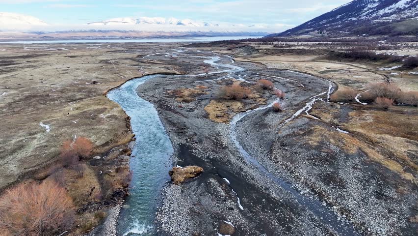 Patagonia River In El Calafate Santa Cruz Argentina. Tropical River With A Scenic Forest Trees Viewed From Above. Snow Fall Lake Glacial Landscape Snow Mountain. Snow Fall Lagoon Nature.