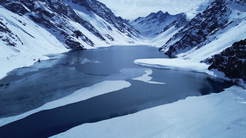 Del Inca Lagoon In Andes Mountains Santiago Chile. Aerial View Of A Ski Resort Nestled In The Snowy Mountains. Snowflakes Tourism Swiss Alps Blizzard. Snowflakes Glacier. Andes Mountains Santiago.