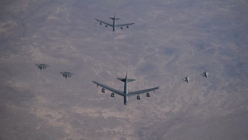 B-52H bombers, F-15E Strike Eagles, and F-16IQ Vipers fly together in formation