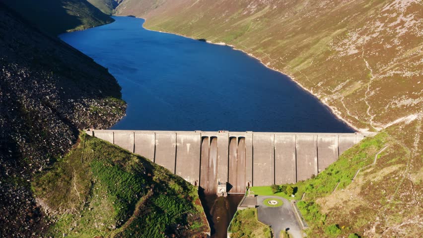 Forward-Panning Aerial Shot Revealing Ben Crom Dam in the Mourne Mountains
