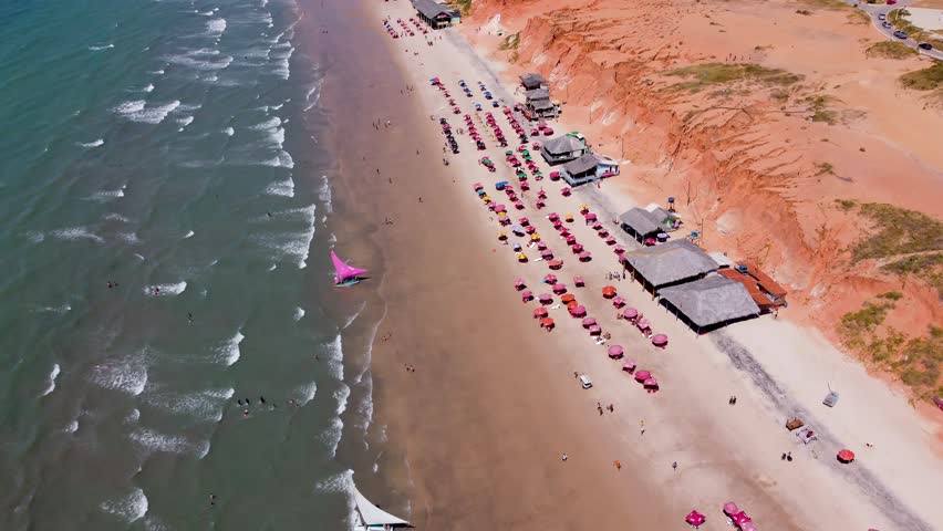 Scenic Beach In Canoa Quebrada Ceara Brazil. Turquoise Ocean Waves Gently Crashing On Tropical Beach. Coast Clouds Sky Seaside Summertime. Seaside Beach Scenic Coastline. Canoa Quebrada Ceara.
