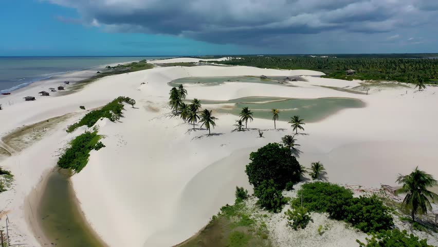 Barrinha Beach In Jericoacoara Ceara Brazil. Turquoise Ocean Waves Gently Crashing On Tropical Beach. Coast Sky Clouds Seaside Summertime. Coast Scenic Coastline. Jericoacoara Ceara.