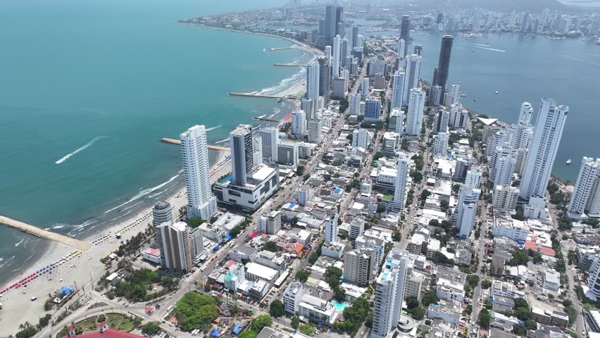 Cartagena, Bolivar, Colombia - 5.22.2025 - Bocagrande At Cartagena In Bolivar Colombia. Sunny Day. Turquoise Ocean Waves Gently Crashing On Tropical Beach.