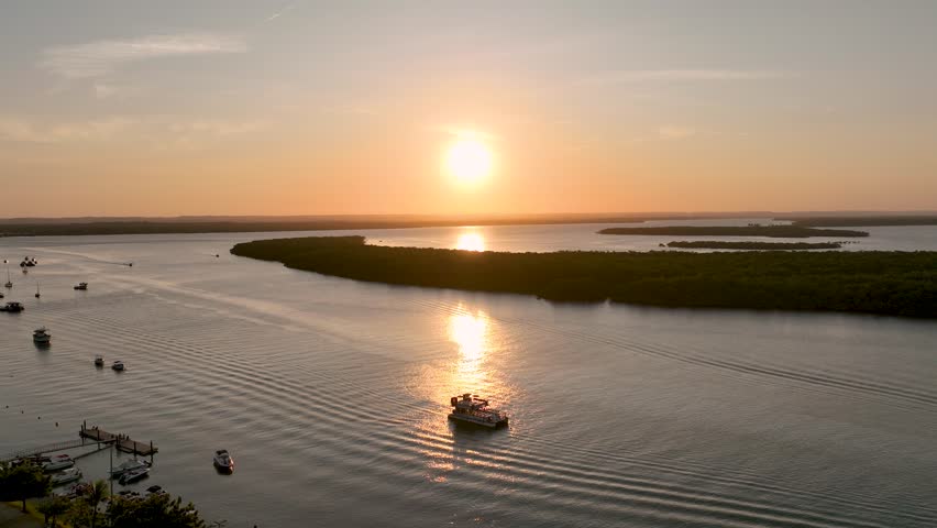 Sunset Edge In Aracaju Sergipe Brazil. Aerial View Of A River Surrounded By Lush Green Tropical Rainforest. Building Industrial Skyline Birds View Stunning. Industrial Cityscape Birds View.