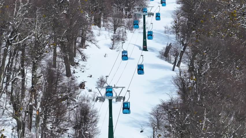 Cerro Catedral In Bariloche Rio Negro Argentina. Chair Lift Transporting Skiers And Snowboarders. Outdoor Travel Patagonia Glacier. Snow Covered Aerial View Floresta. Bariloche Rio Negro.