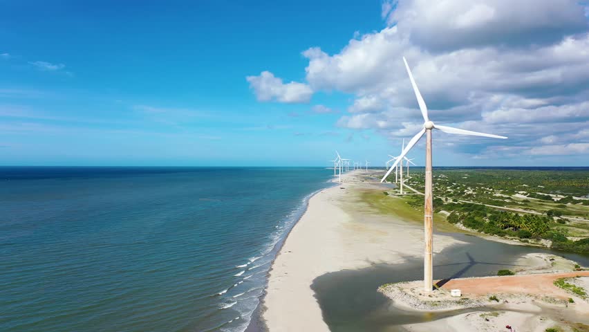 Wind Farm Turbines Field In Jericoacoara Ceara Brazil. Wind Farm Generating Clean Energy On Beautiful Tropical Coastline. Coast Clouds Sky Seaside Summertime. Seaside Beach Scenic Coastline.
