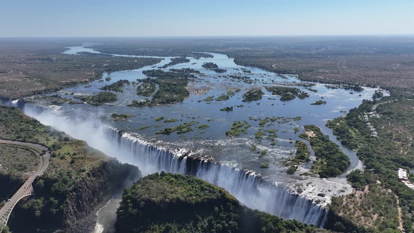 Zimbabwe Skyline In Victoria Falls Matabeleland North Zimbabwe. Experience The Majestic Flow Of Waterfalls With Lush Greenery. Idyllic Falls Powerful Waterfall Beauty. Idyllic Travel Nature.