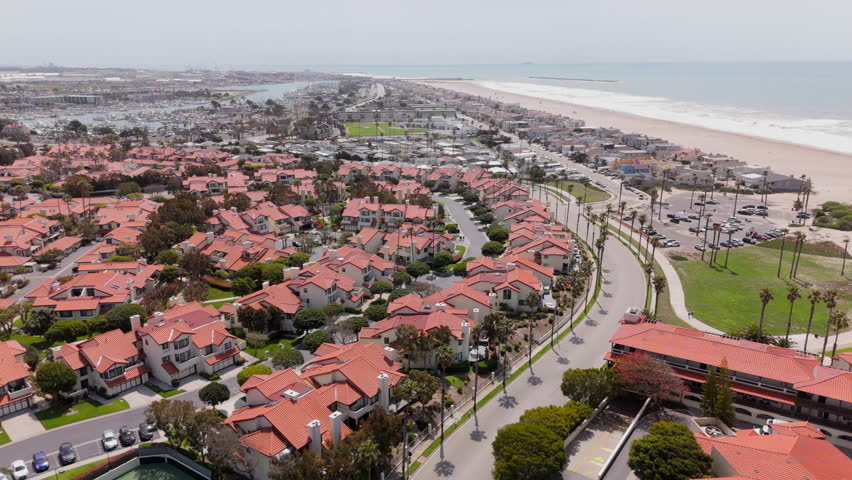 Experience breathtaking and captivating aerial footage of Oxnard, California, which showcases its stunning beachfront properties, vibrant greenery, and mesmerizing ocean views that visitors adore