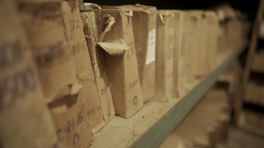 Old Document In Archive Department. Archival Material. Bookkeeping File Shelf. 
Archive Texts In Films And Reports. Highly Classified Documents. National Archives Records. Old Secret Archival Document