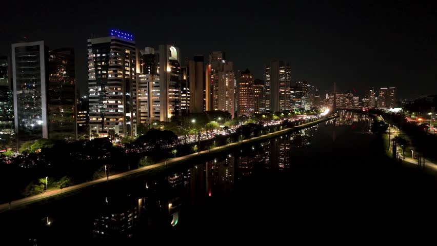 Illuminated Buildings In City Night Sao Paulo Brazil. Aerial View Of Rooftop Skyscraper In Landmark Downtown. Night Freeway Road Downtown Cityscape. Night Outdoor Famous. City Night Sao Paulo.