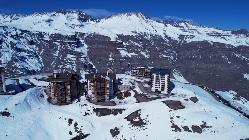 Valle Nevado Village In Andes Mountains Santiago Chile. Chair Lift Transporting Skiers And Snowboarders. Outdoor Tourism Icon Andes Glacier. Sky Andes High Angle View. Andes Mountains Santiago.
