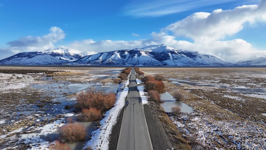 Patagonia Road In El Calafate Santa Cruz Argentina. Stunning Landscape Of Highway Road Viewed From Above. Nature Travel Destinations Snow Covered Forest Trees. Exterior Snow Covered High Angle View.