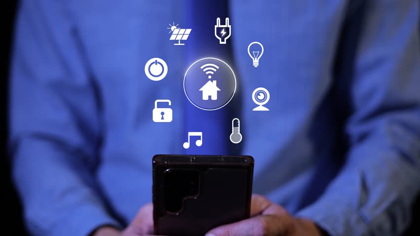 Hands Using Smartphone Displaying Smart Home Control Interface With Various Icons. Home Automation. closeup shot