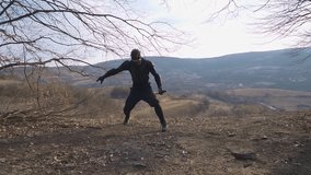 Watch a stealth ninja expertly unfold his katana while performing stunning sword tricks in an outdoor, scenic setting. Perfect for martial arts and dynamic action projects. - Powered by Shutterstock - Get 15% off with code: PIKWIZARD15