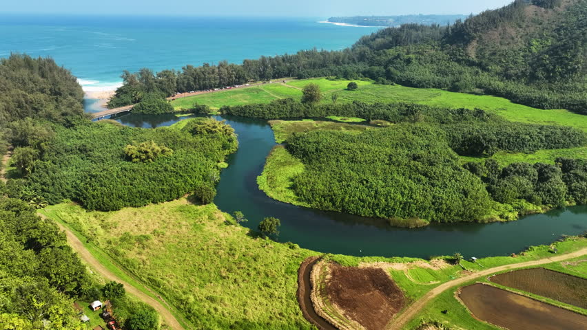 Aerial view overlooking the Lumahai river in Kauai, sunny day in Hawaii