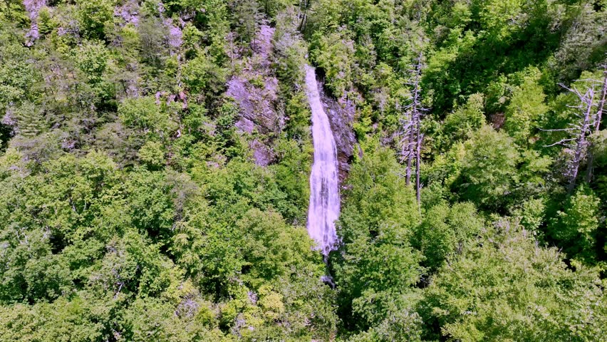 aerial push in to Mingo Falls Waterfall near Cherokee NC, North Carolina
