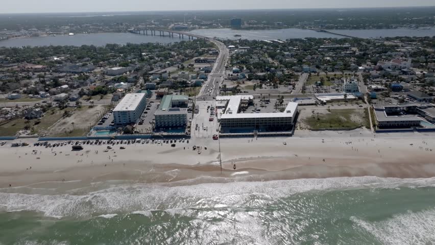 Daytona Beach, Florida with waves from the Atlantic Ocean and stable drone video.