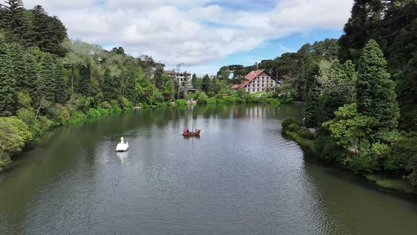 Black Lake In Gramado Rio Grande Do Sul Brazil. Famous Botanical Garden Showing The Around The City. Town Clouds Sky Backgrounds Urban. Town Outdoor Panning Wide. Gramado Rio Grande do Sul.