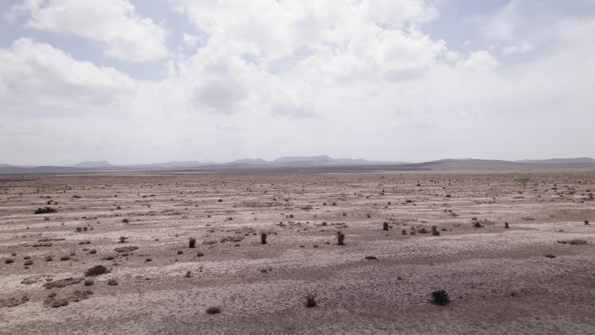 The West Texas Chihuahuan Desert in the Big Bend Region, aerial view rises over sparse sandy landscape