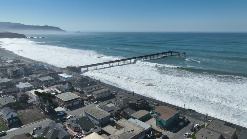 Fishing Pier In Pacifica California United States. Group Of Fishermen Pulling A Fishing Net On A Tropical Beach. Coast Clouds Sky Seaside Summertime. Seaside Beach Scenic Coastline.