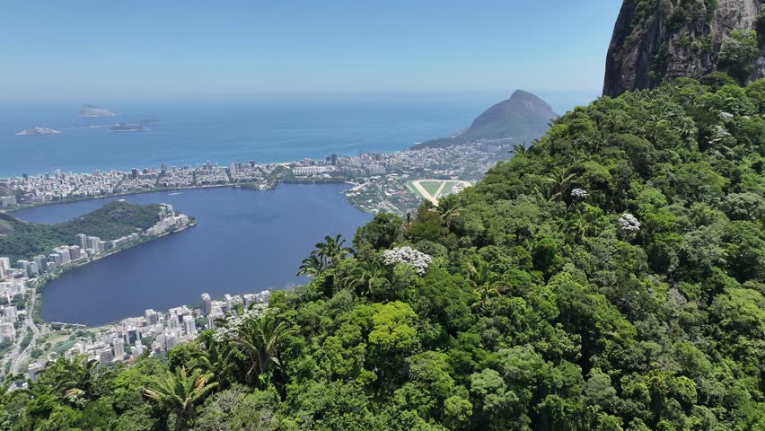 Atlantic Forest In Rio De Janeiro Brazil. Birds Eye View Of Peaceful Mountains Valley And Forest Trees. Sunset Sky Downtown Cityscape. Sunset Outdoors Panning Wide. Rio de Janeiro Brazil.