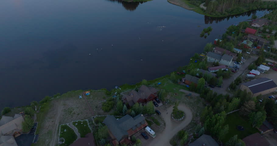 Tilting Drone shot of Shadow Mountain Lake at sunset in Colorado