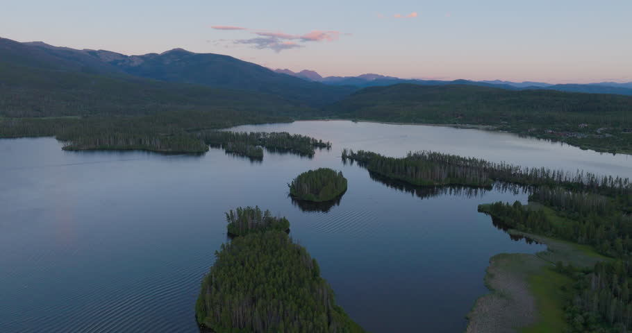 Orbiting Drone shot of Shadow Mountain Lake at sunset in Colorado