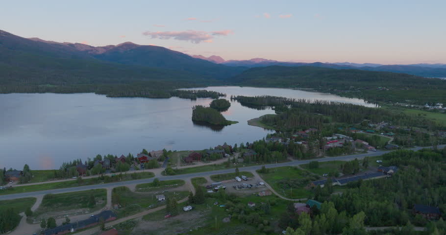 Drone shot pushing in on Shadow Mountain Lake at sunset in Colorado