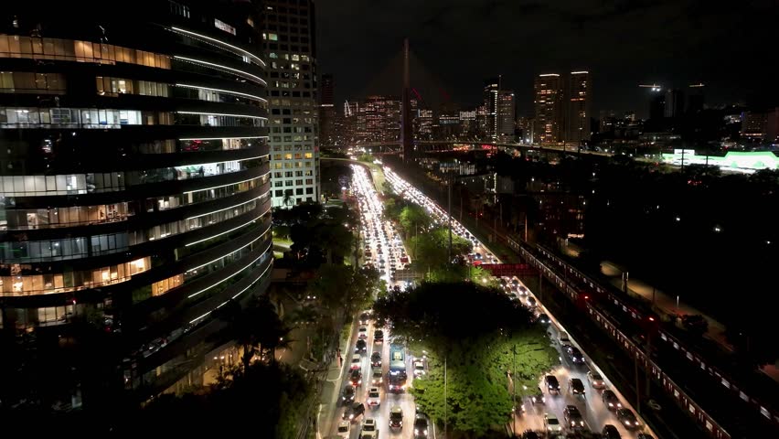 Street Traffic In Night City Sao Paulo Brazil. Aerial View Of A High-Rise Buildings And Traffic Showcasing Urban Life. Building Town Clouds Sky Illuminated Urban. Town Outdoors Illuminated .