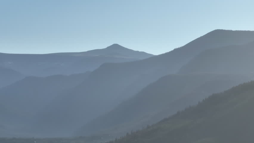 Telephoto drone shot of the Rocky Mountains in Grand Lake, Colorado at sunrise