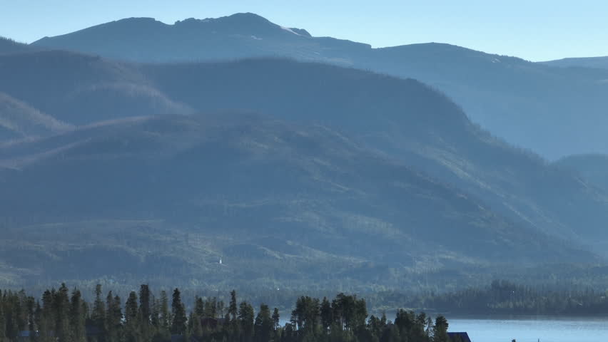 Telephoto drone shot of the Rocky Mountains in Grand Lake, Colorado at sunrise