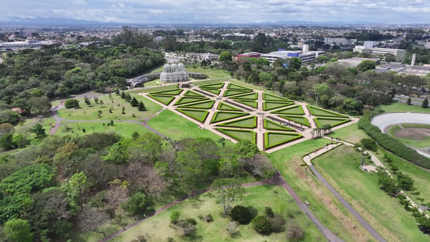 Botanical Garden In Curitiba Parana Brazil. Aerial View Of Lush Green Park And Surrounding Buildings. Business Sky Clouds Downtown Cityscape. Backgrounds Panoramic. Curitiba Parana.