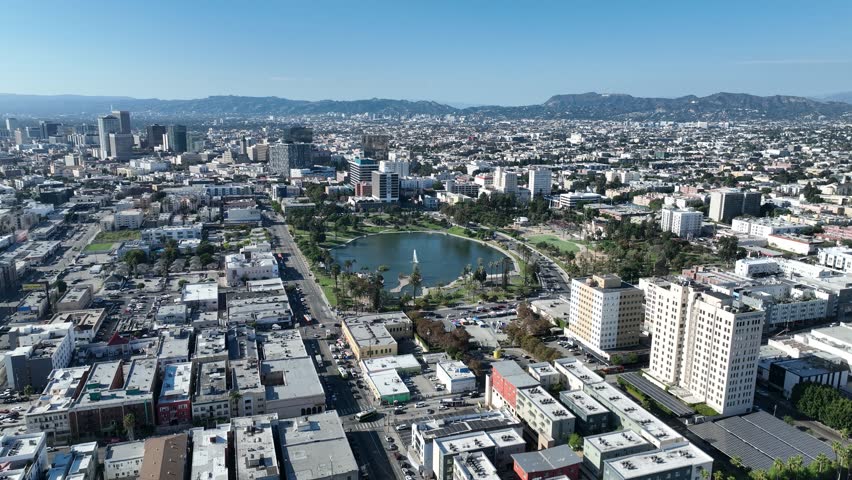 Macarthur Park Lake In Los Angeles California United States. Beautifully Designed Park Adorned With Lush Greenery. Business Sky Background Downtown Cityscape. Backgrounds Panoramic.