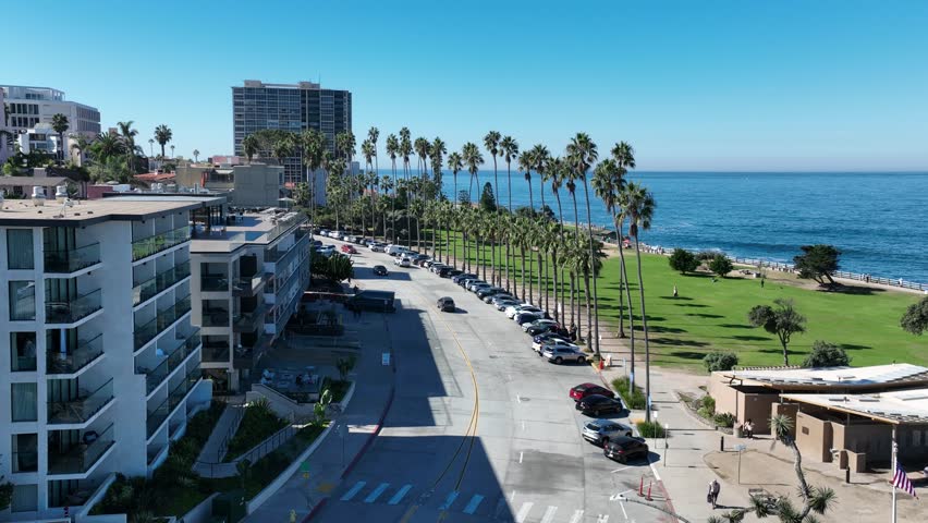 La Jolla In San Diego California United States. Turquoise Ocean Waves Gently Crashing On Tropical Beach. Business Sky Clouds Downtown Cityscape. Backgrounds Panoramic. San Diego California.