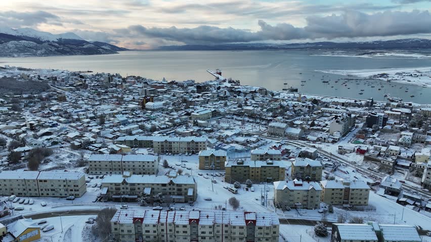 Ushuaia Skyline In Ushuaia Tierra Del Fuego Argentina. Amazing Countryside Scenery Near Farm And Forest Trees. Snowflakes Lake Glacial Snow Mountain. Snowflakes Nature. Ushuaia Tierra Del Fuego.