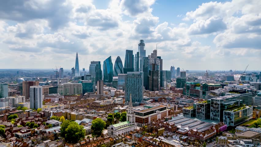 Aerial hyper time lapse view of the skyline at the City of London, England, during a cloudy day