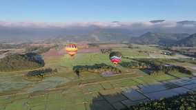 Colorful Balloon In Praia Grande Santa Catarina Brazil. Bright Colorful Hot Air Balloon Is Floating Over A Green Countryside. Nature Dramatic Sky Sky Forest. Nature Agro Rural Panoramic View. - Powered by Shutterstock - Get 15% off with code: PIKWIZARD15