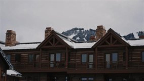 Rustic Chalets with Snowy Peaks Behind in Wyoming - Powered by Shutterstock - Get 15% off with code: PIKWIZARD15
