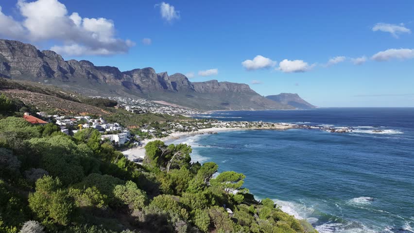 Camps Bay Beach In Cape Town Western Cape South Africa. Bustling Downtown Cityscape With Modern Buildings. Shore Horizon Beach Sea. Seaside Panning Wide. Cape Town Western Cape.