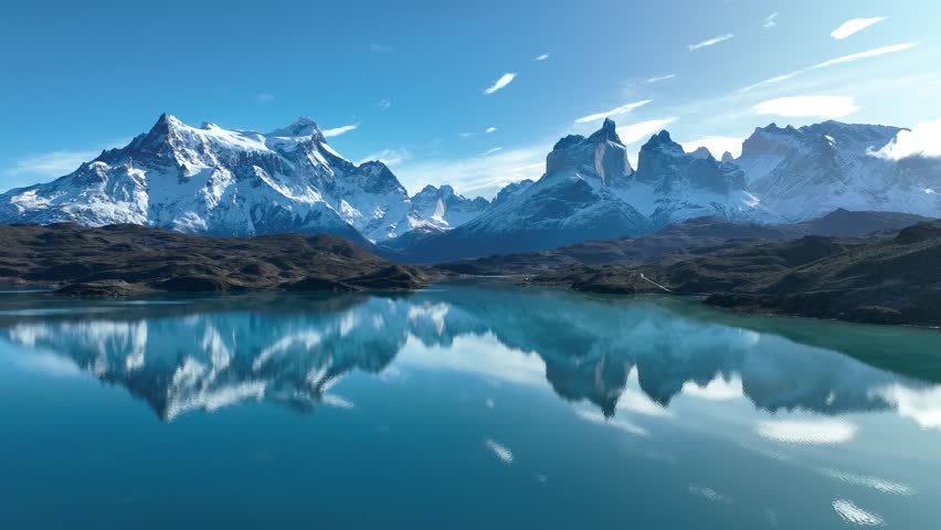National Park In Torres Del Paine Punta Arenas Chile. Aerial View Of A River Surrounded By Lush Green Tropical Rainforest. Snowflakes Lake Glacial Snow Mountain. Snowflakes Nature.