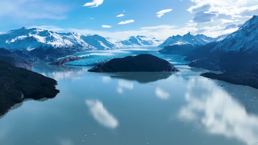Grey Glacial In Torres Del Paine Puerto Natales Chile. Glacier Calving Into Icy Lagoon With Snow Capped Mountains. Outdoor Tourism Icon Patagonia Glacier. Outdoor Patagonia High Angle View.