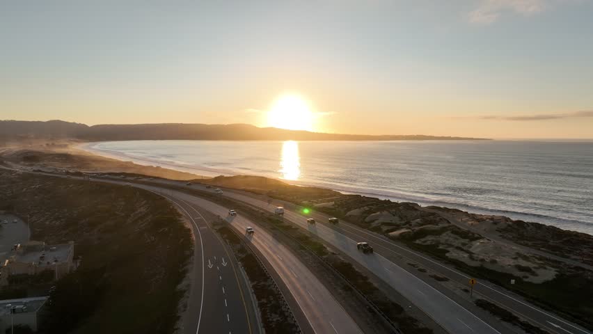 Sunset Beach In Monterey California United States. Breathtaking Aerial View Of A Lush Tropical Coastline Scenery. Sunset Coast Sky Clouds City Seaside. Outdoor Panoramic. Monterey California.