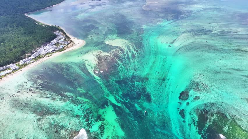 Underwater Waterfall In Le Morne Beach Mauritius Island Mauritius. Turquoise Ocean Waves Gently Crashing On Tropical Beach. Shore Sky Clouds Beach Sea. Seaside Scenic Coastline.