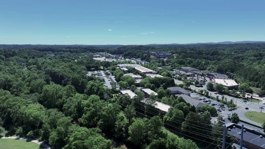 aerial footage of a gorgeous landscape with lush green trees and grass at Etowah River Park in Canton Georgia USA