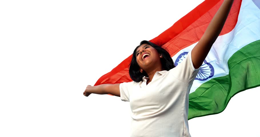Holding Indian Flag, Cheerful Teenage Girl Standing in Open Air as Tricolour Flutters in the Wind, Happy Asian Child Displaying National Pride and Patriotism Under Blue Sky with Joyful Expression