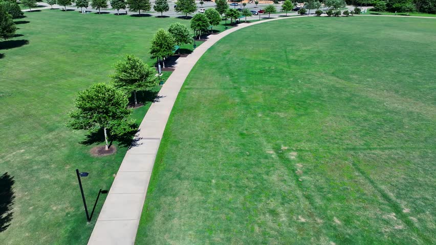 aerial footage of a gorgeous landscape with lush green trees and grass at Etowah River Park in Canton Georgia USA