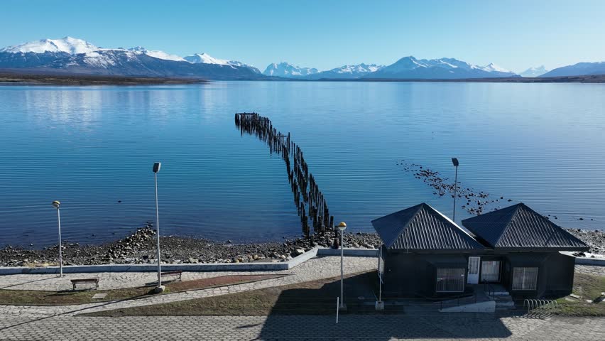 Port Harbor In Puerto Natales Magallanes Chile. Birds Eye View Of Stunning Dark River And Forest Trees. Nature Travel Destination Snow Covered Forest Trees. Nature Sky Patagonia Aerial View.