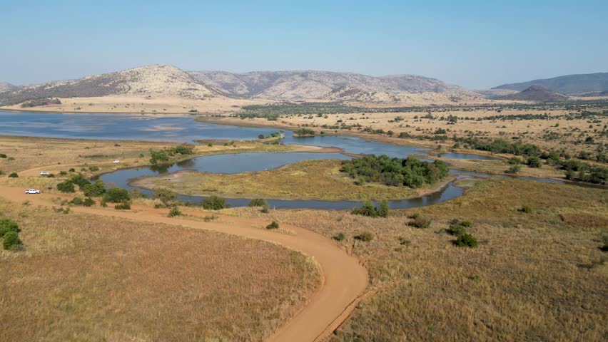 Pilanesberg Park In Rustenburg North West South Africa. Game Drive Safari Scenery In The African Savannah. Nature Sky Clouds Sky Forest. Nature Agro Panning Wide. Rustenburg North West.
