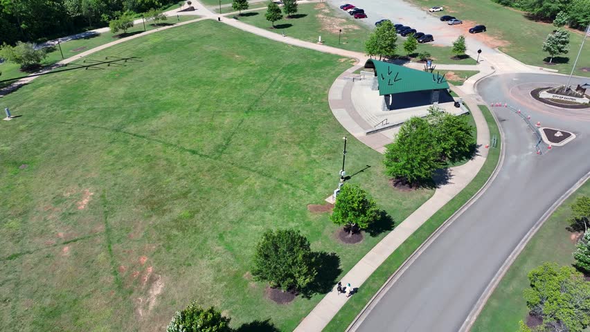 aerial footage of a gorgeous landscape with lush green trees and grass at Etowah River Park in Canton Georgia USA